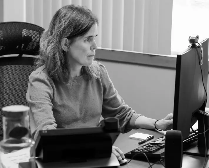 LBA staff member working at a computer